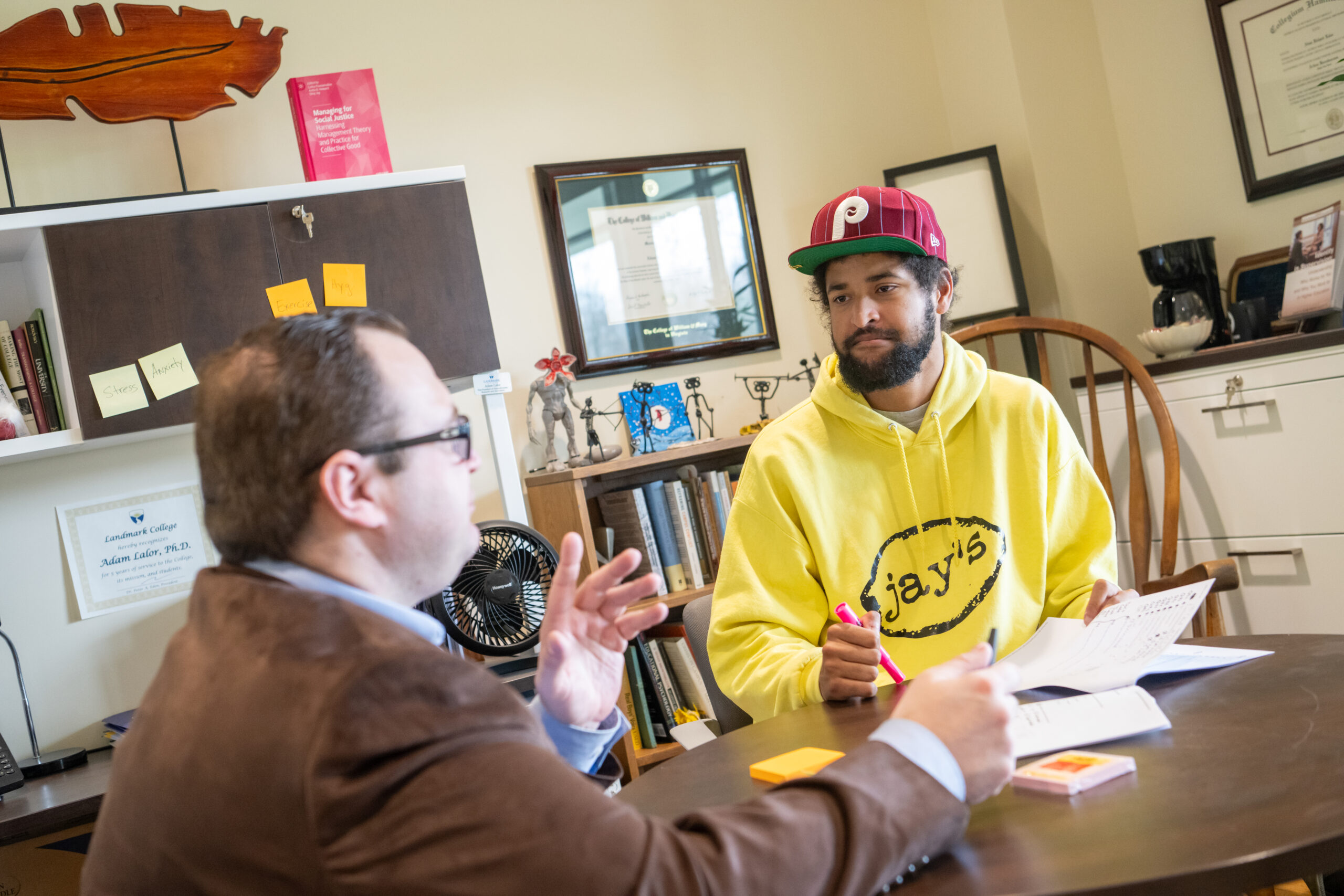 Adam Lalor meets with a student at Landmark College. 