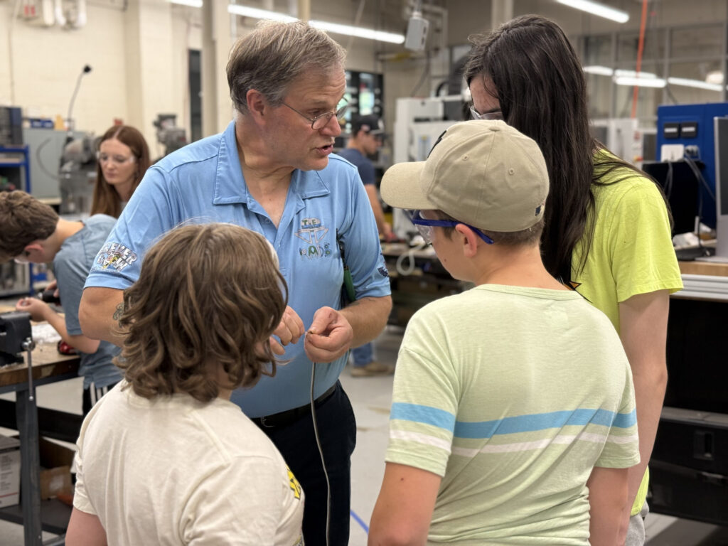 Chris Gray teaching students.