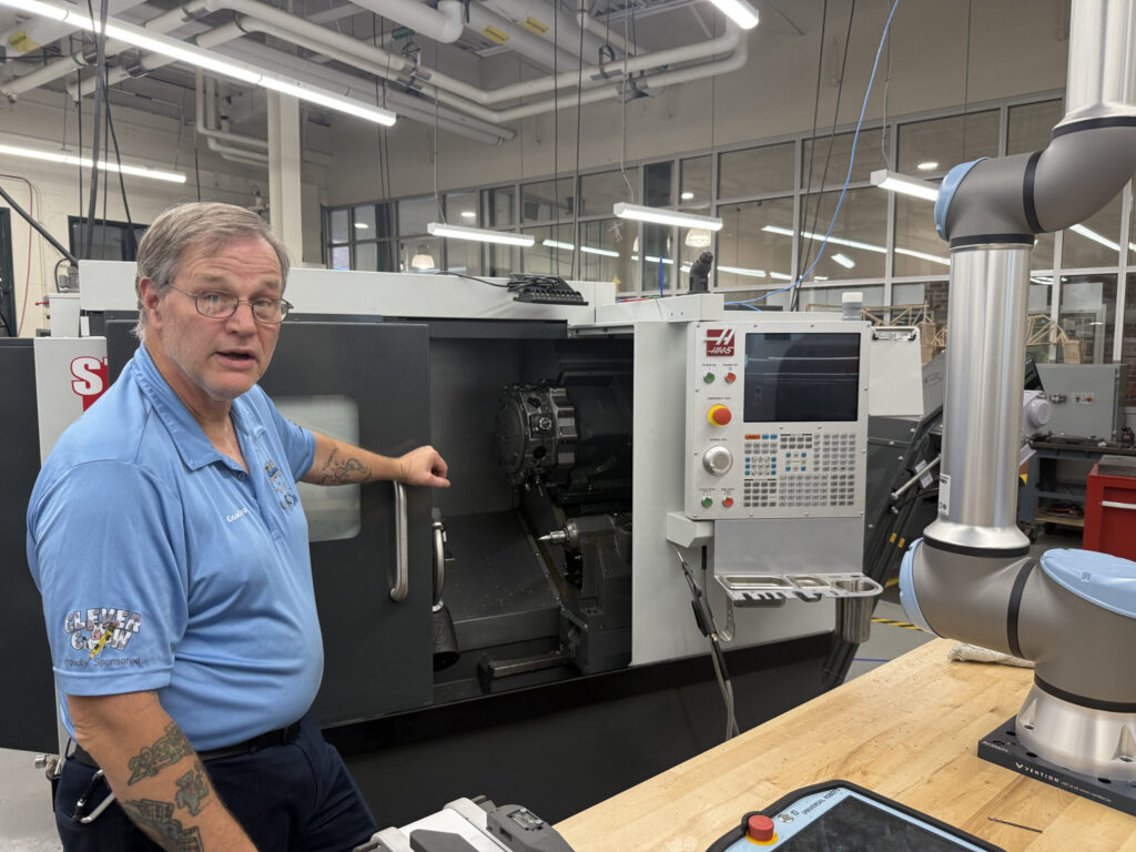Chris Gray shows River Valley Tech Center equipment.