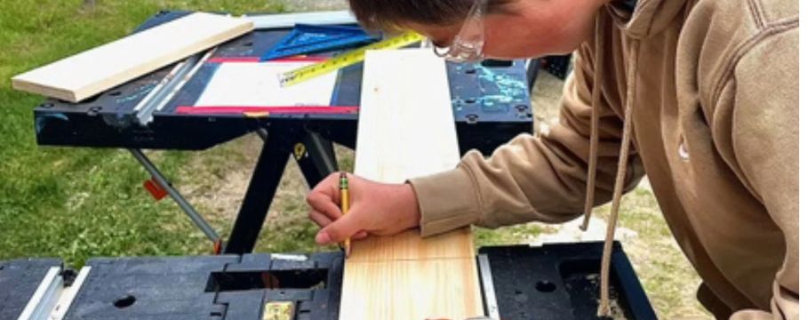 Student marks line for cutting as part of STEAD award: Nest Quest.